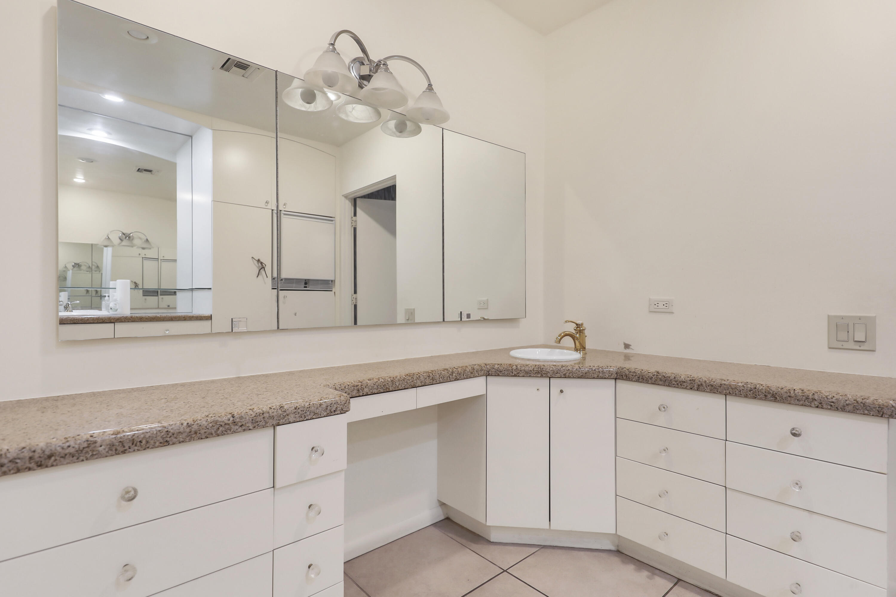 770 South La Mirada Road Palm Springs, CA 92264 - Photo 11 of 39 a bathroom with a sink and a mirror