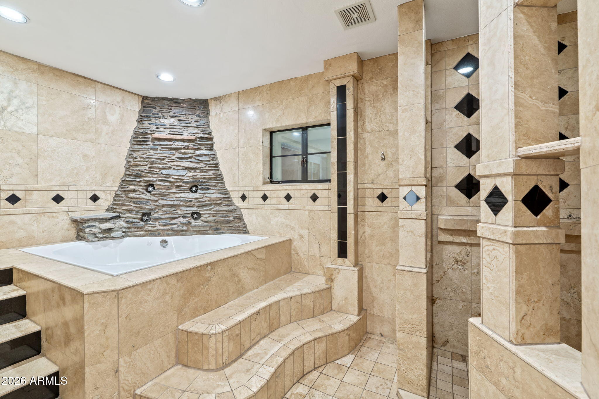1345 East Ocotillo Road Phoenix, AZ 85014 - Photo 21 of 34 a bathroom with a sink and mirror with bathtub