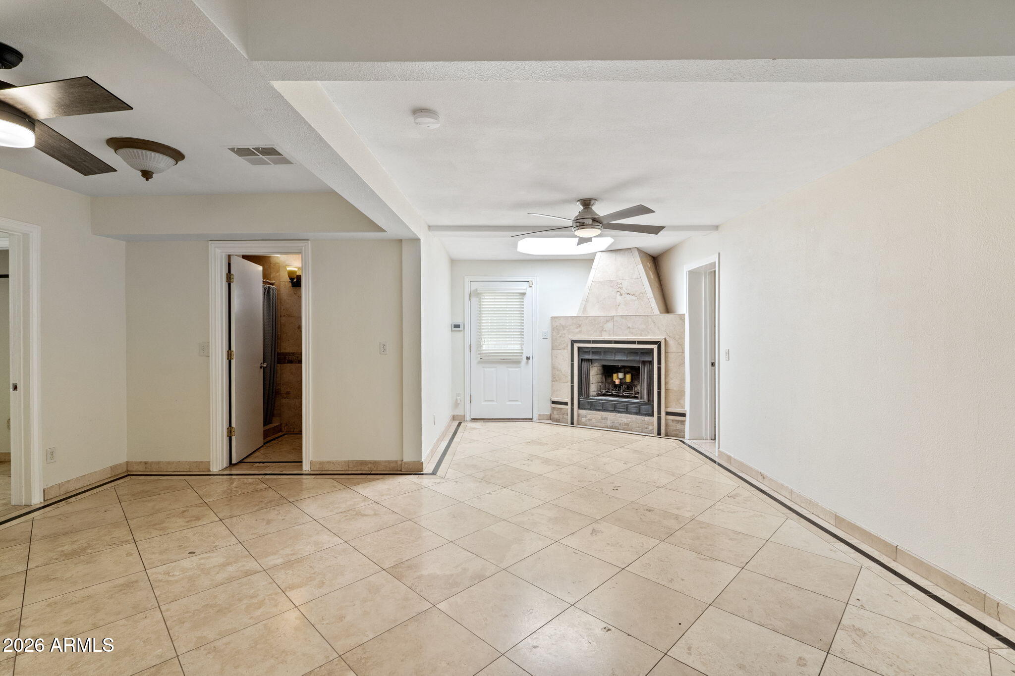 1345 East Ocotillo Road Phoenix, AZ 85014 - Photo 23 of 34 a view of an empty room with a fireplace