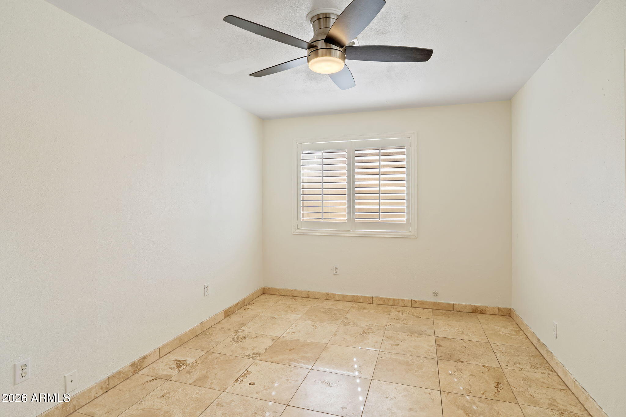 1345 East Ocotillo Road Phoenix, AZ 85014 - Photo 24 of 34 an empty room with windows and fan