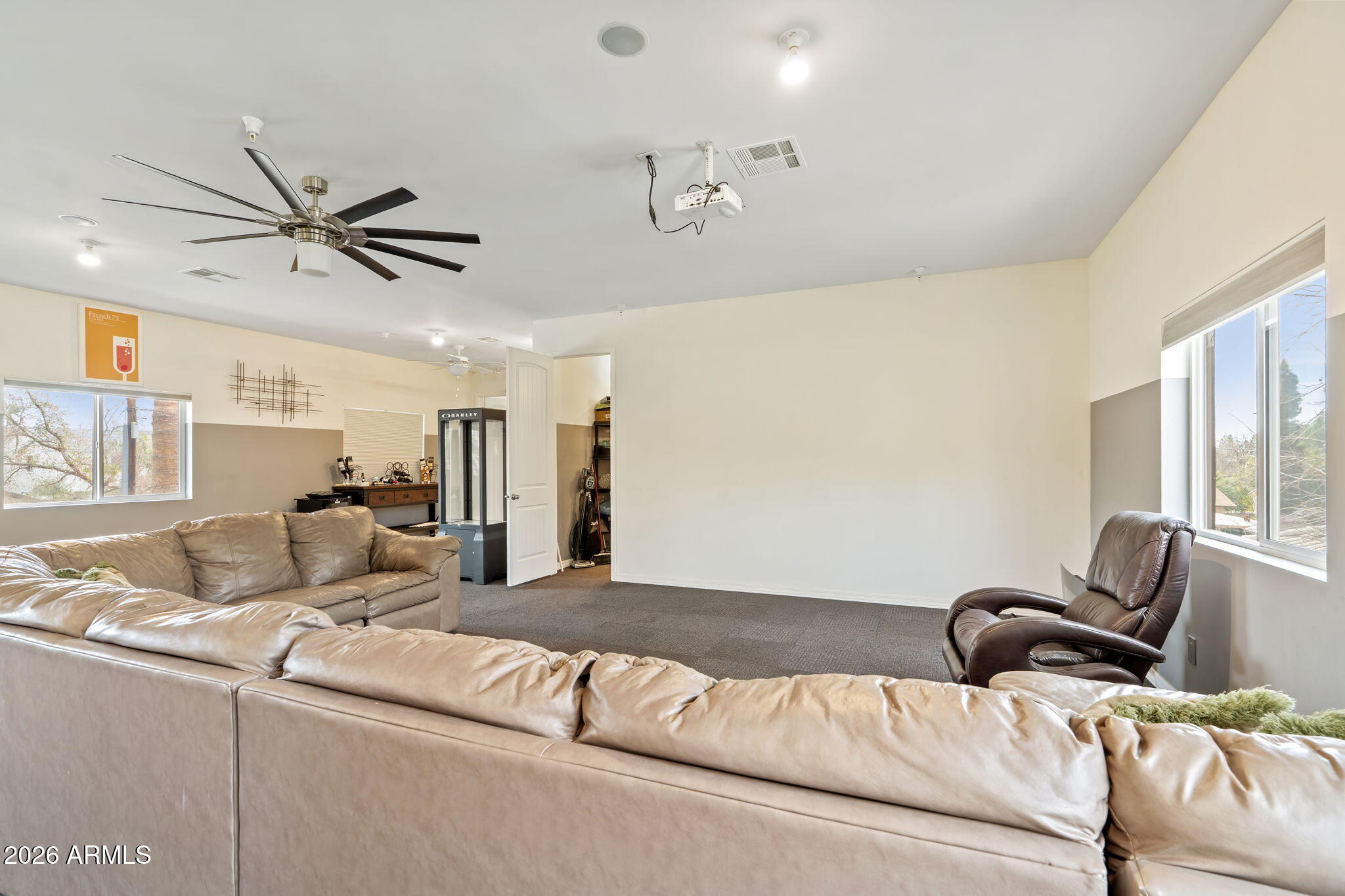 1345 East Ocotillo Road Phoenix, AZ 85014 - Photo 29 of 34 a living room with furniture and a ceiling fan
