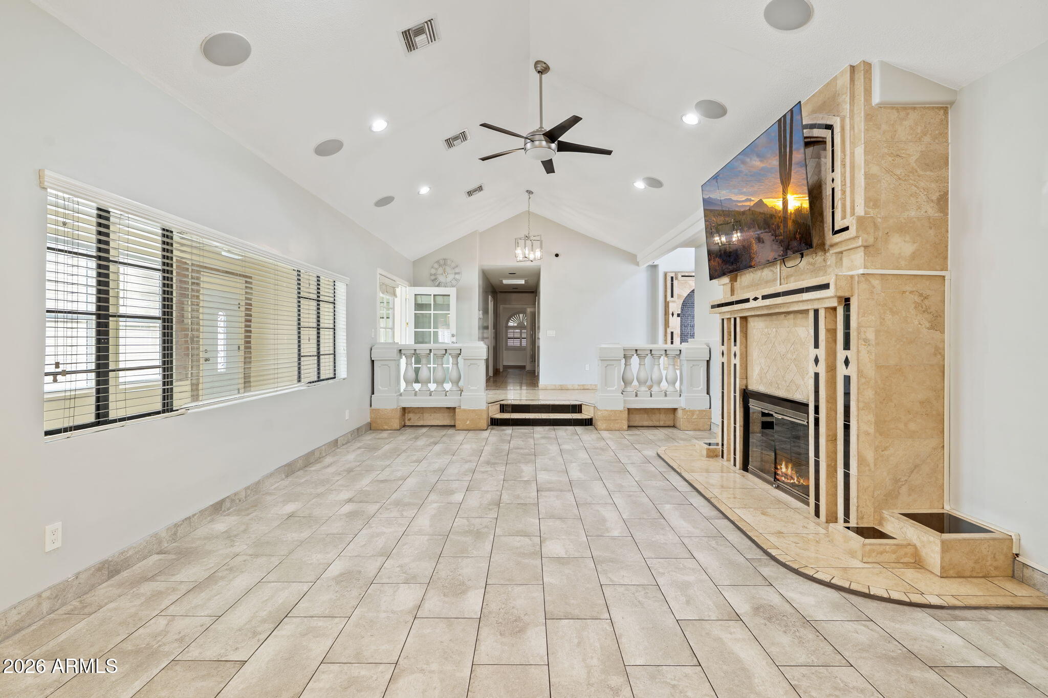 1345 East Ocotillo Road Phoenix, AZ 85014 - Photo 7 of 34 a view of an empty room with fireplace and windows