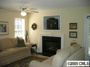 6119 Nevin Road Charlotte, NC 28262 - Photo 2 of 8 a living room with furniture and a fireplace