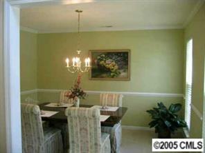 6119 Nevin Road Charlotte, NC 28262 - Photo 3 of 8 a view of a dining room with furniture and chandelier