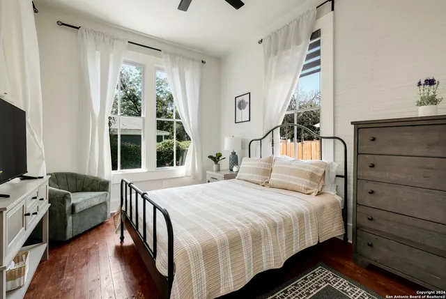 a bedroom with a bed and a window