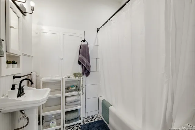 a bathroom with a sink and a mirror