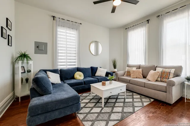 a living room with furniture and a large window