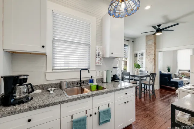 a kitchen with lots of counter space and a window