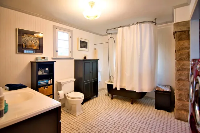 a bedroom with a bed and a table