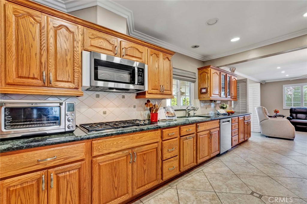 5456 Cadbury Road Whittier, CA 90601 - Photo 26 of 67 a kitchen with stainless steel appliances granite countertop a sink and a microwave