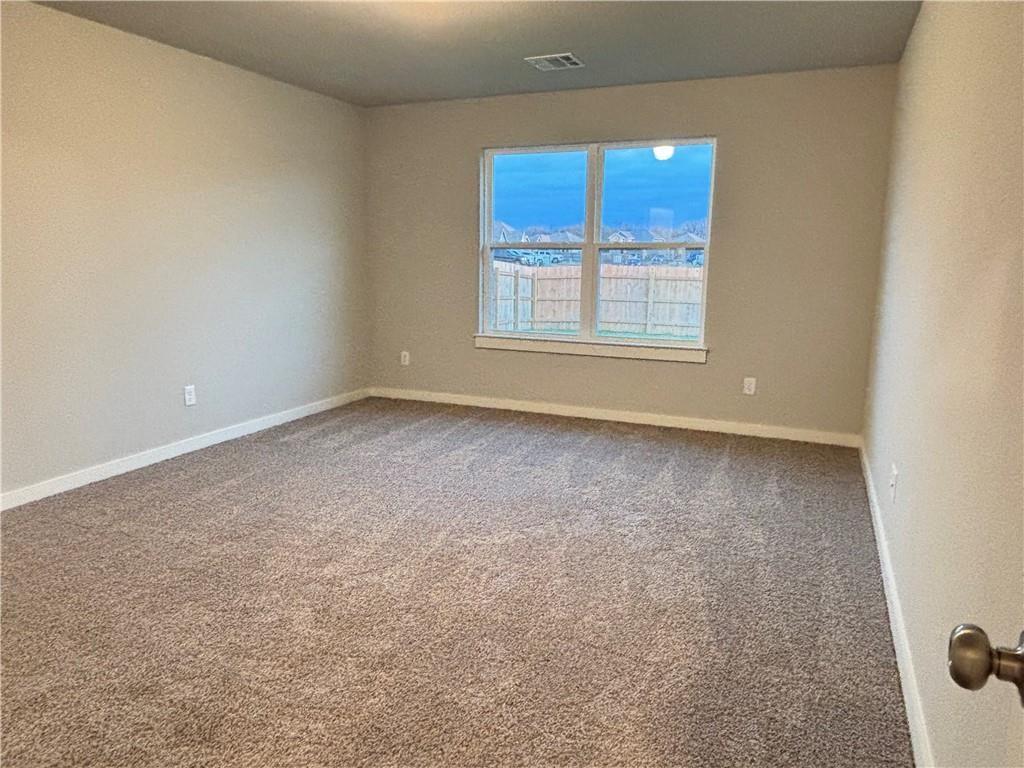 4229 Centerfire Road Waco, TX 76705 - Photo 6 of 14 an empty room with windows