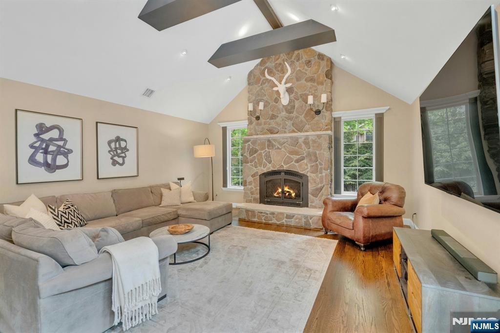 48 Hopper Farm Road Upper Saddle River, NJ 07458 - Photo 32 of 43 a living room with furniture and a fireplace