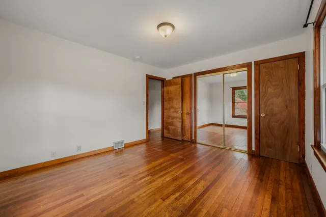 a view of empty room with white walls