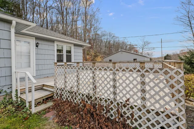 a view of a swimming pool with an outdoor space and seating area