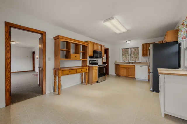 a kitchen with a sink stove and microwave