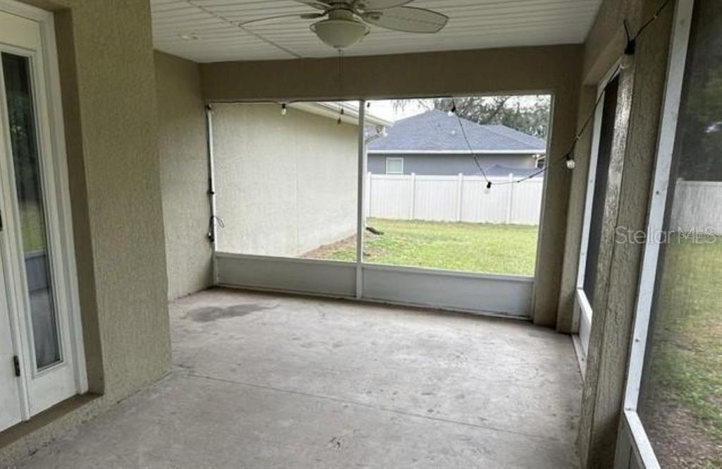 3707 Southeast 24th Street Ocala, FL 34471 - Photo 13 of 14 a view of an empty room with a fireplace and a window