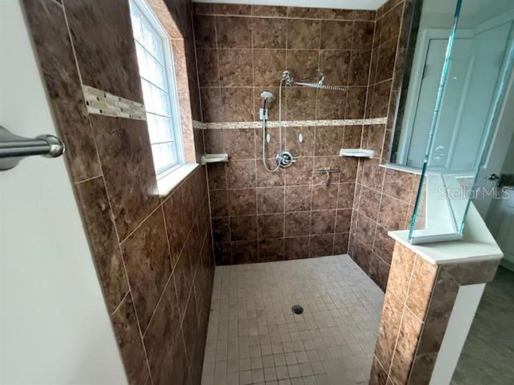 3707 Southeast 24th Street Ocala, FL 34471 - Photo 8 of 14 a bathroom with a shower