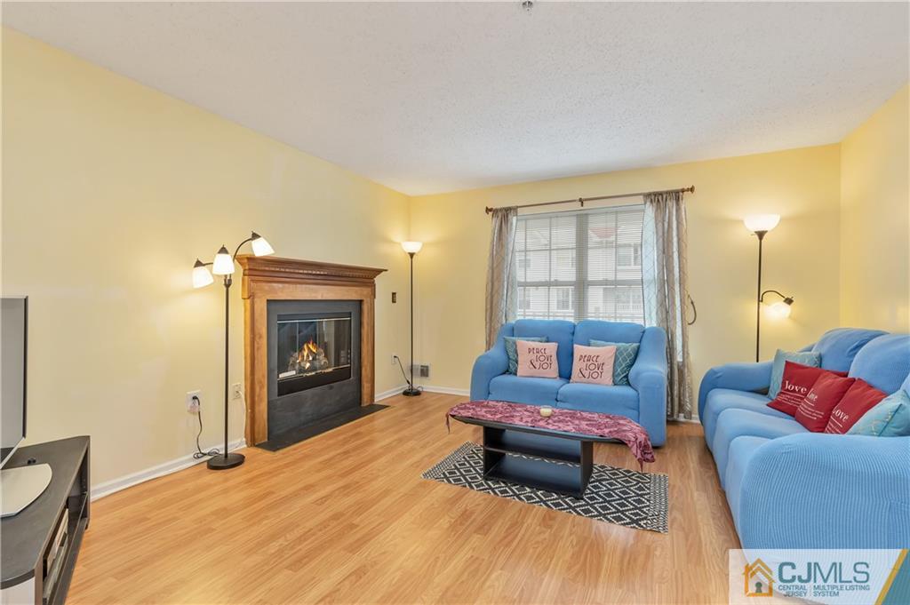110 Prestwick Way Edison, NJ 08820 - Photo 2 of 26 a living room with furniture and a fireplace