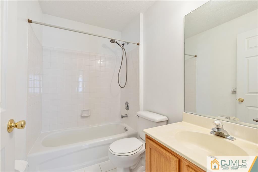 110 Prestwick Way Edison, NJ 08820 - Photo 12 of 26 a bathroom with a sink a toilet and a bathtub