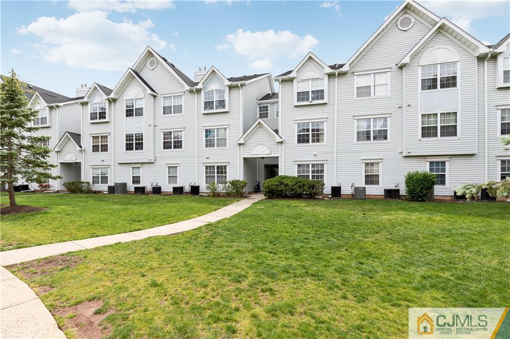 110 Prestwick Way Edison, NJ 08820 - Photo 26 of 26 a large white building with a yard in front of it