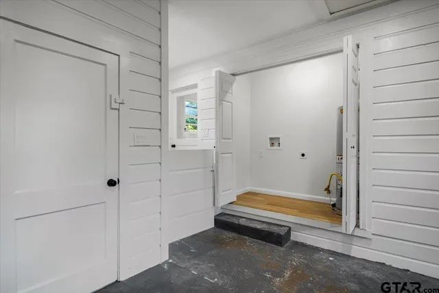 a bathroom with a tub and shower