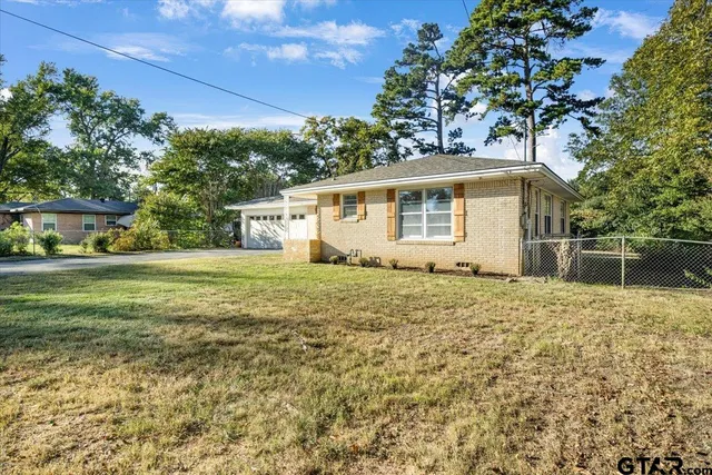 a house view with a garden space