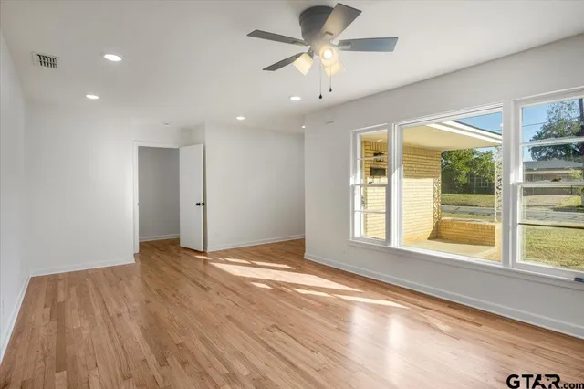 a view of an empty room with a window