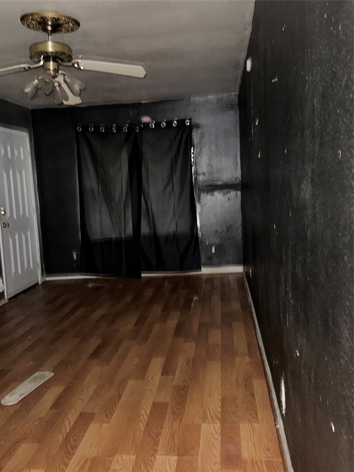 4730 Angleton Street Houston, TX 77033 - Photo 8 of 16 The cozy den offers convenient access to both the kitchen and backyard, making it perfect for entertaining or relaxing with family.