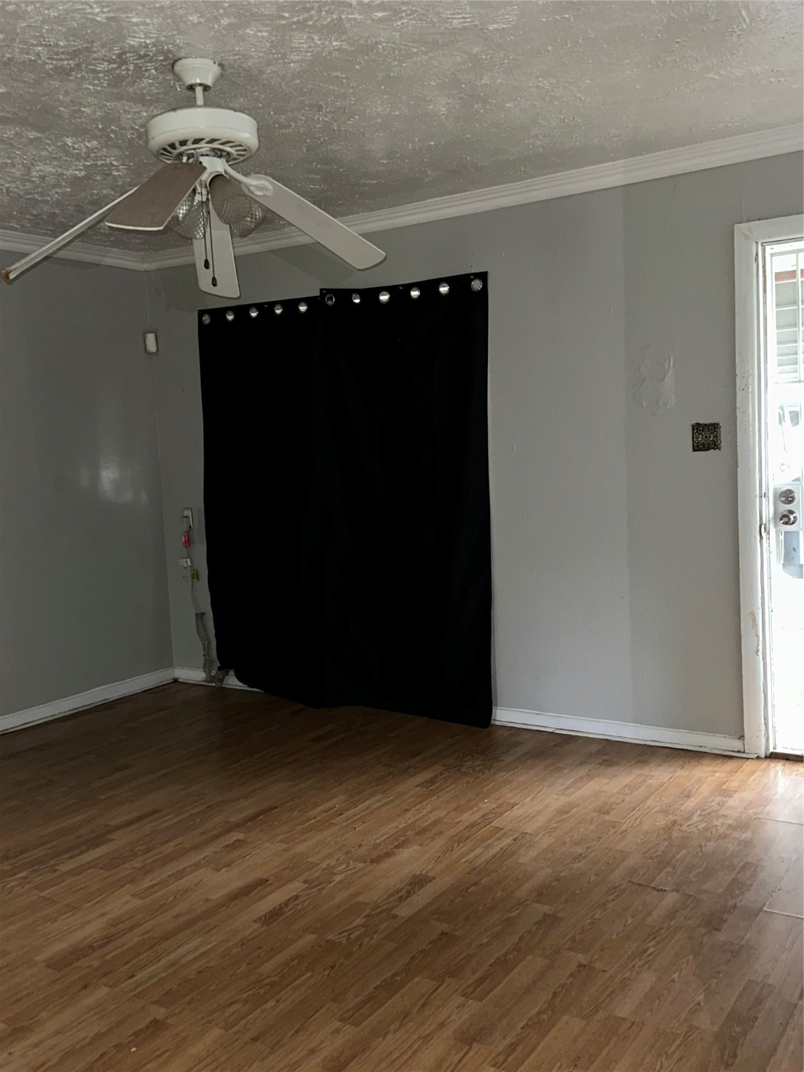 4730 Angleton Street Houston, TX 77033 - Photo 9 of 16 Spacious and inviting, the family room offers an open layout that seamlessly connects to the kitchen, creating the perfect space for both relaxing and entertaining. Abundant natural light pours in through large windows, highlighting the room's warmth and making it the heart of the home