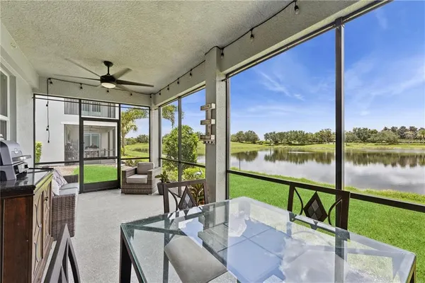 a view of a living room and floor to ceiling window