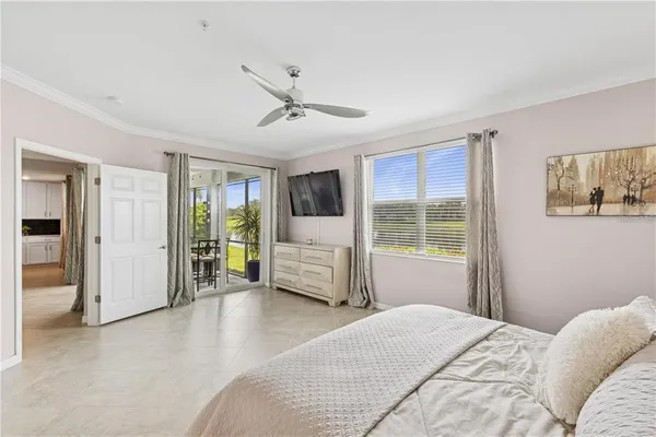 a bedroom with a large bed and a window