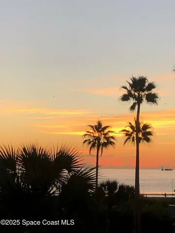 a aerial view of a house with a yard and garage