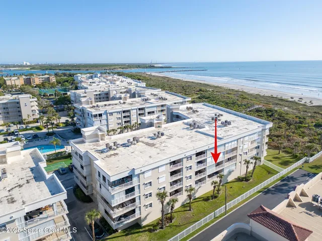 an aerial view of a house with a garden