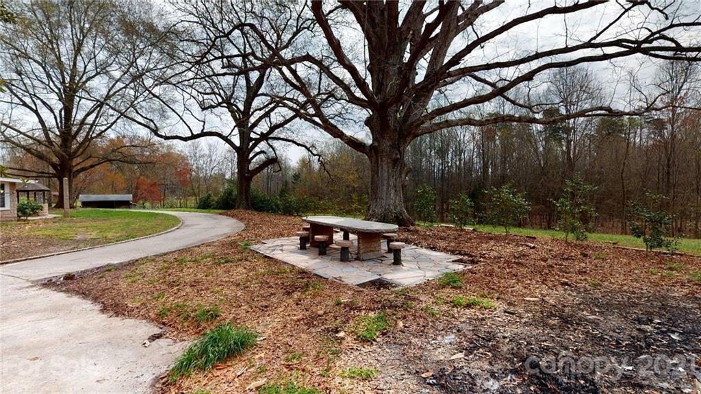 185 Rainey Road Salisbury, NC 28146 - Photo 17 of 47 a view of a park with a bench