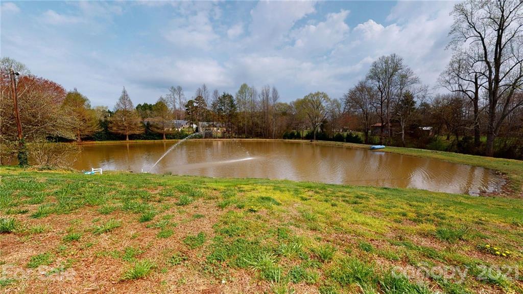 185 Rainey Road Salisbury, NC 28146 - Photo 22 of 47 a view of a lake with houses in the back
