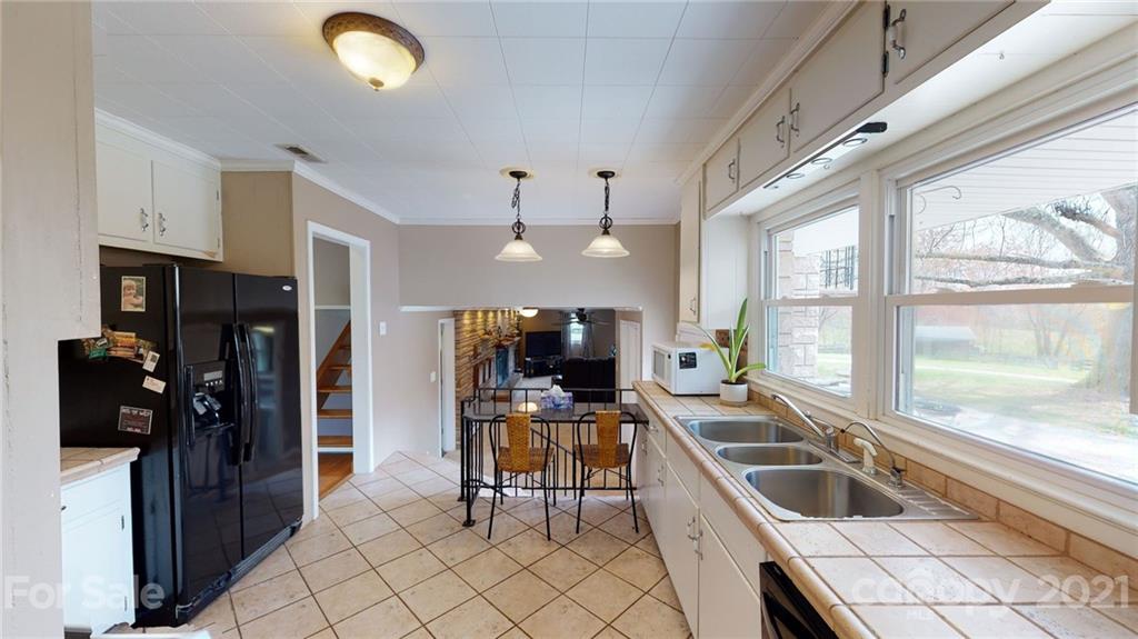 185 Rainey Road Salisbury, NC 28146 - Photo 30 of 47 a kitchen with a sink and a stove top oven