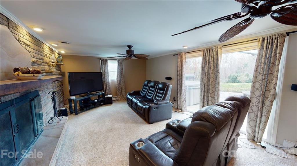 185 Rainey Road Salisbury, NC 28146 - Photo 33 of 47 a living room with furniture and a flat screen tv