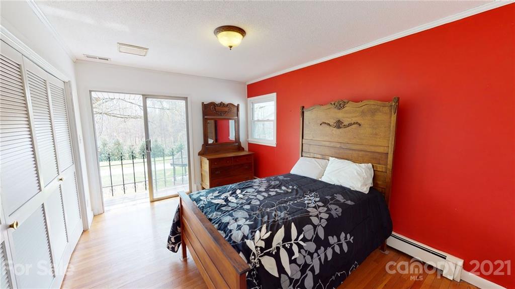 185 Rainey Road Salisbury, NC 28146 - Photo 38 of 47 a bed sitting in a bedroom next to a window