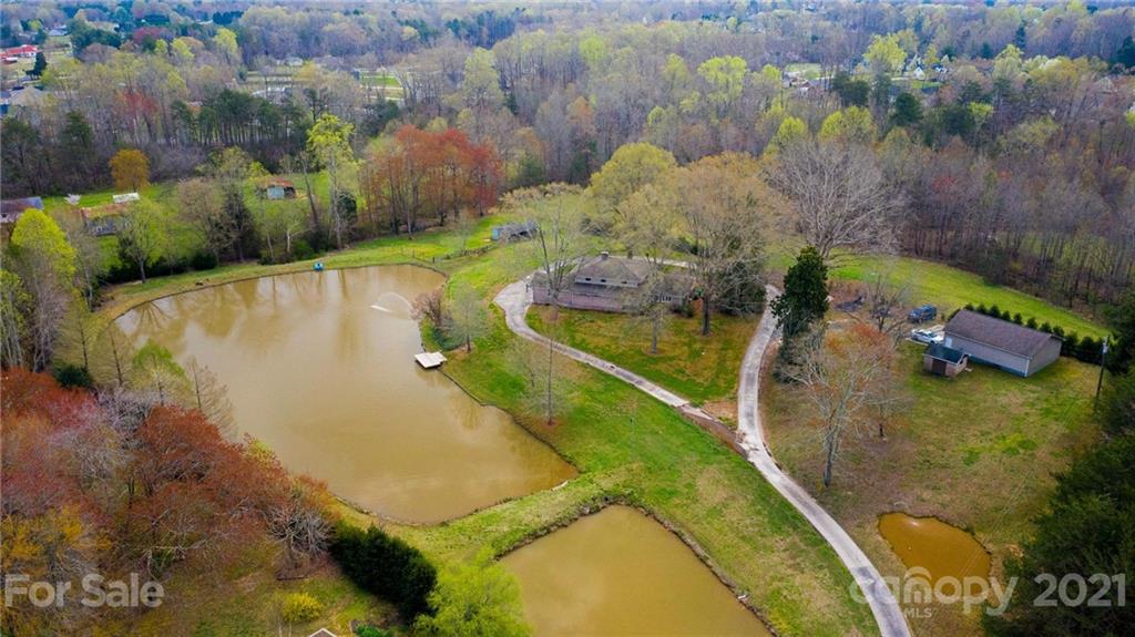 185 Rainey Road Salisbury, NC 28146 - Photo 5 of 47 a view of a swimming pool with a yard