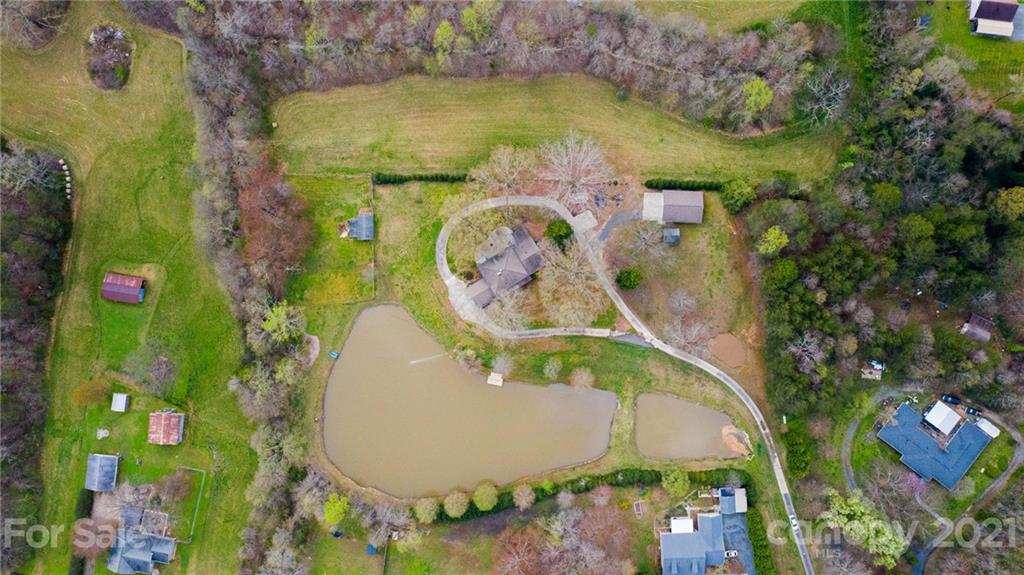 185 Rainey Road Salisbury, NC 28146 - Photo 7 of 47 an aerial view of a swimming pool with outdoor seating and yard