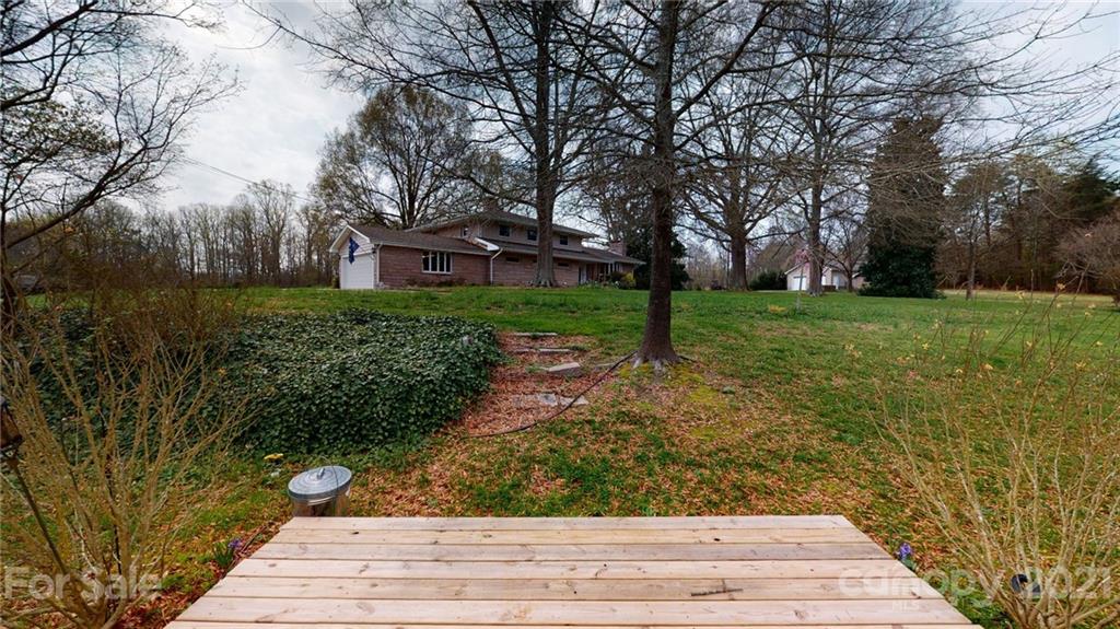 185 Rainey Road Salisbury, NC 28146 - Photo 8 of 47 a view of a yard and front view of a house
