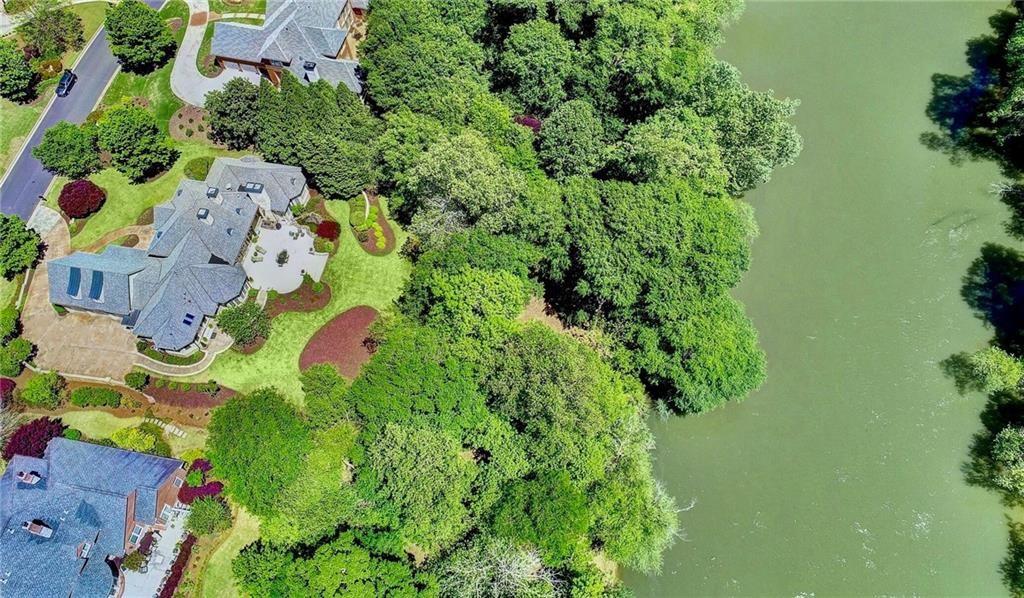 an aerial view of a house with a yard and garden