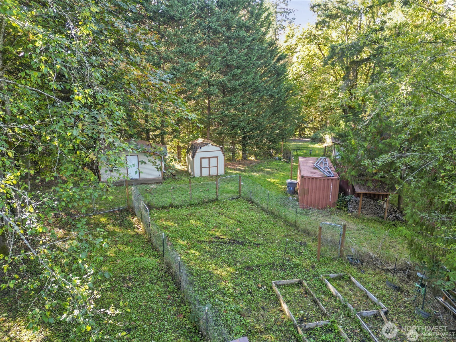 14310 200th Avenue Southeast Renton, WA 98058 - Photo 29 of 39 a backyard of a house with table and chairs