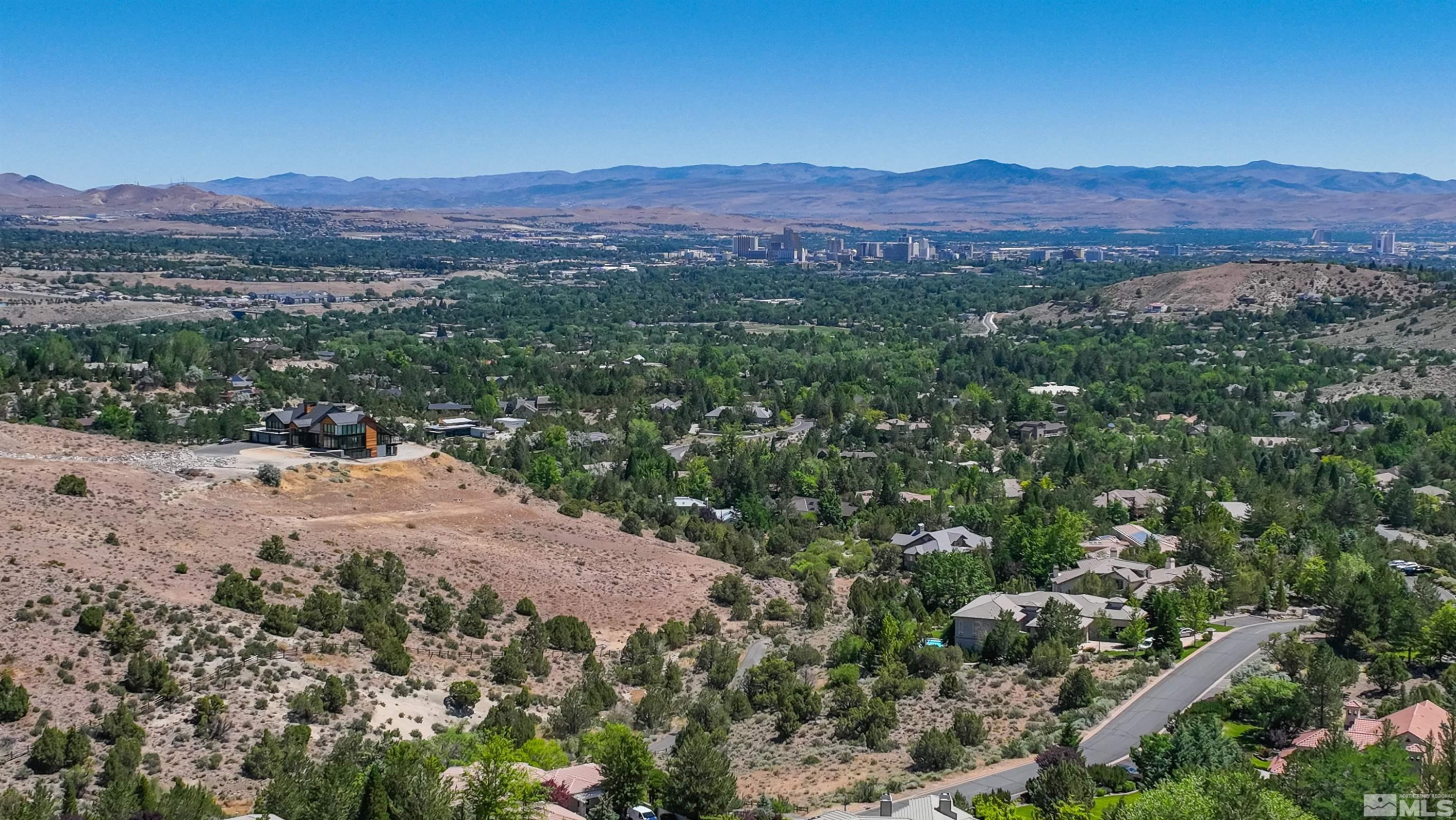 4395 Sharps Road, Unit 714A Reno, NV 89519 - Photo 11 of 15 a view of a lush green hillside and a mountain