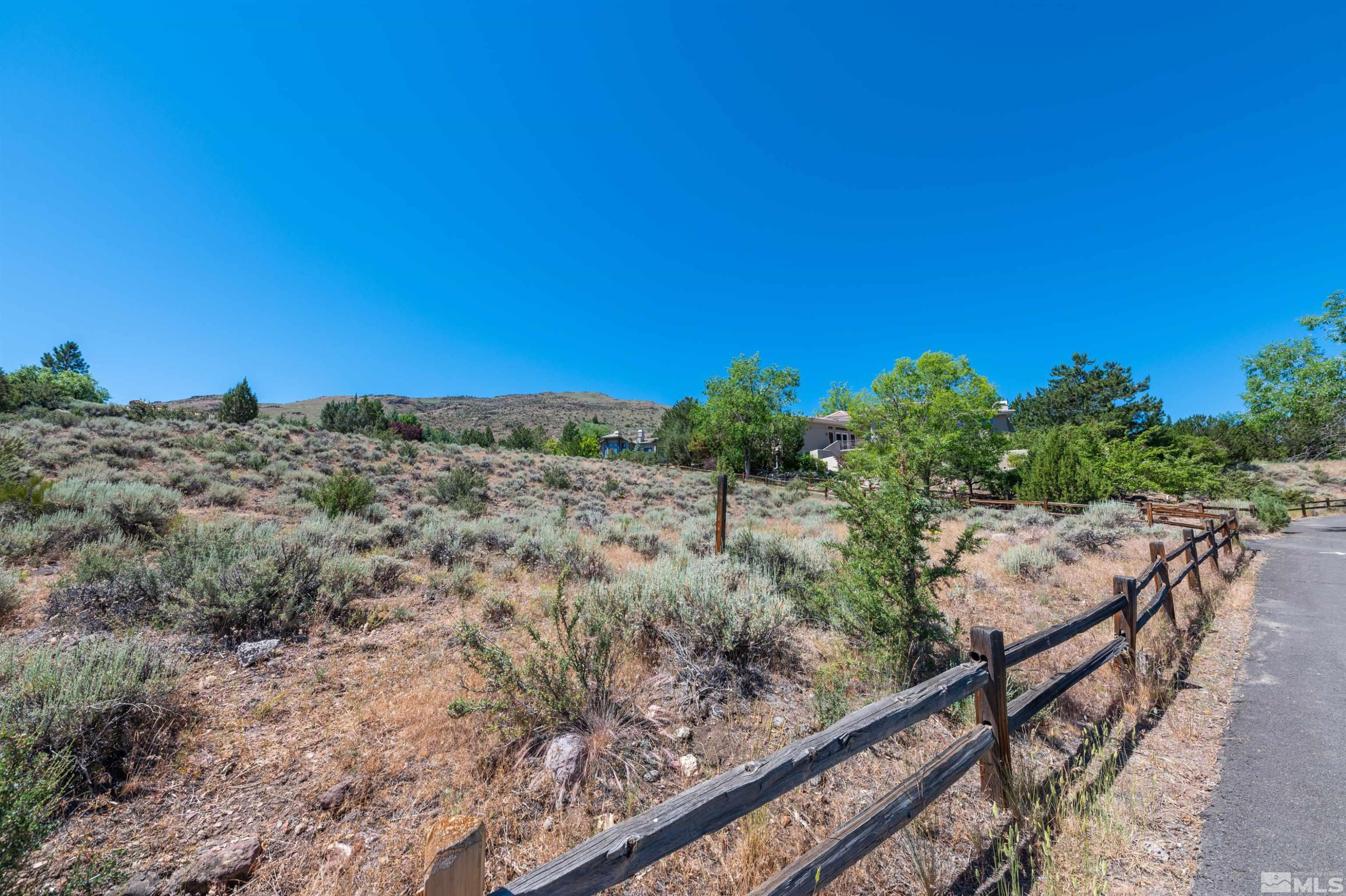4395 Sharps Road, Unit 714A Reno, NV 89519 - Photo 4 of 15 a view of a dry yard with wooden fence