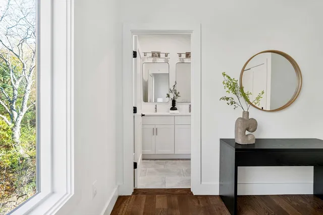 a view of a bathroom sink and a mirror
