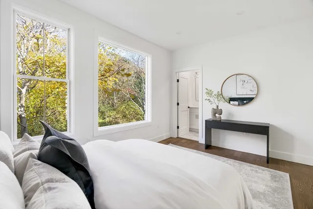 a living room with a bed furniture and a window