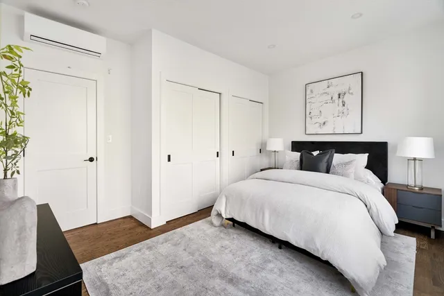 a bedroom with a bed and a couch