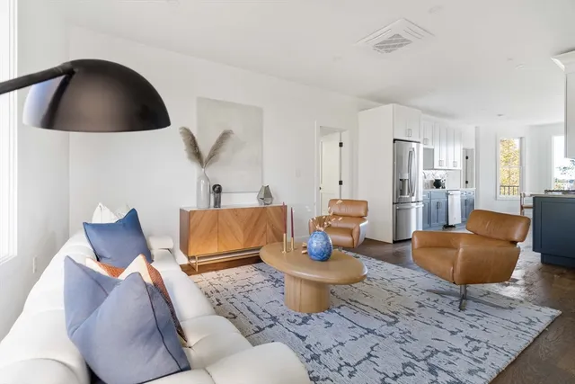 a living room with furniture and a rug