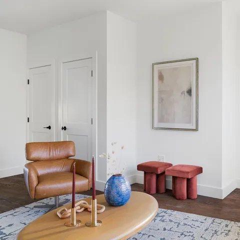 a living room with furniture and a table